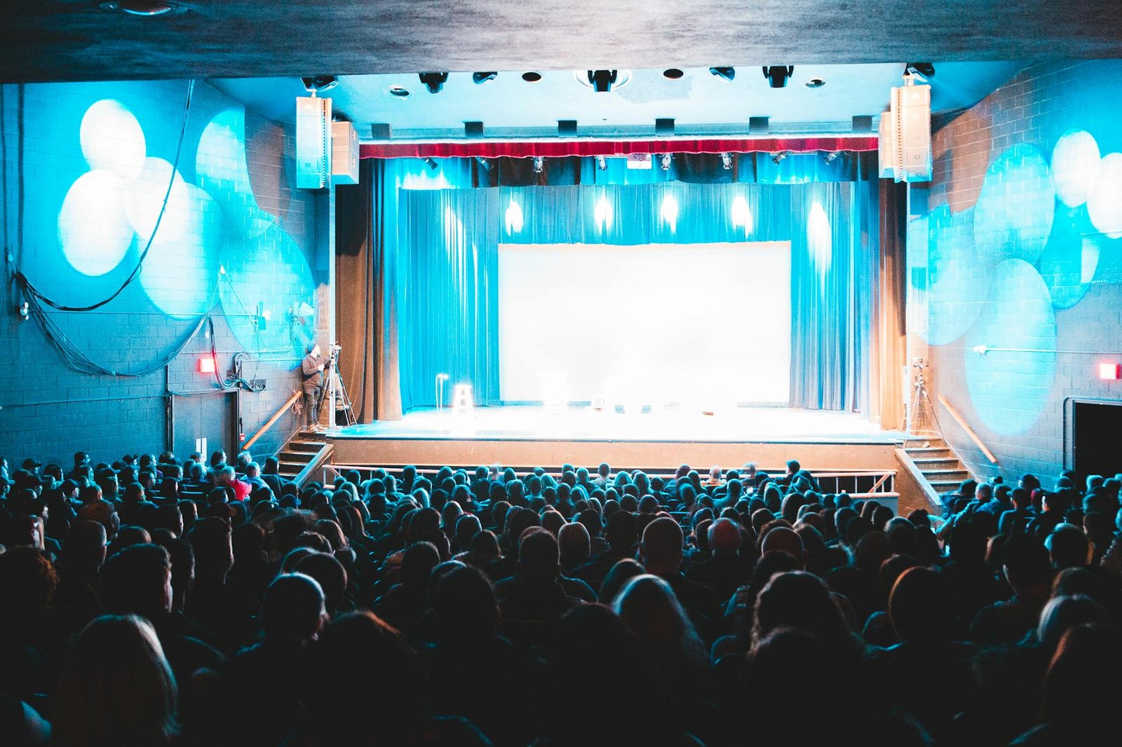 Theater audience under bright stage lights
